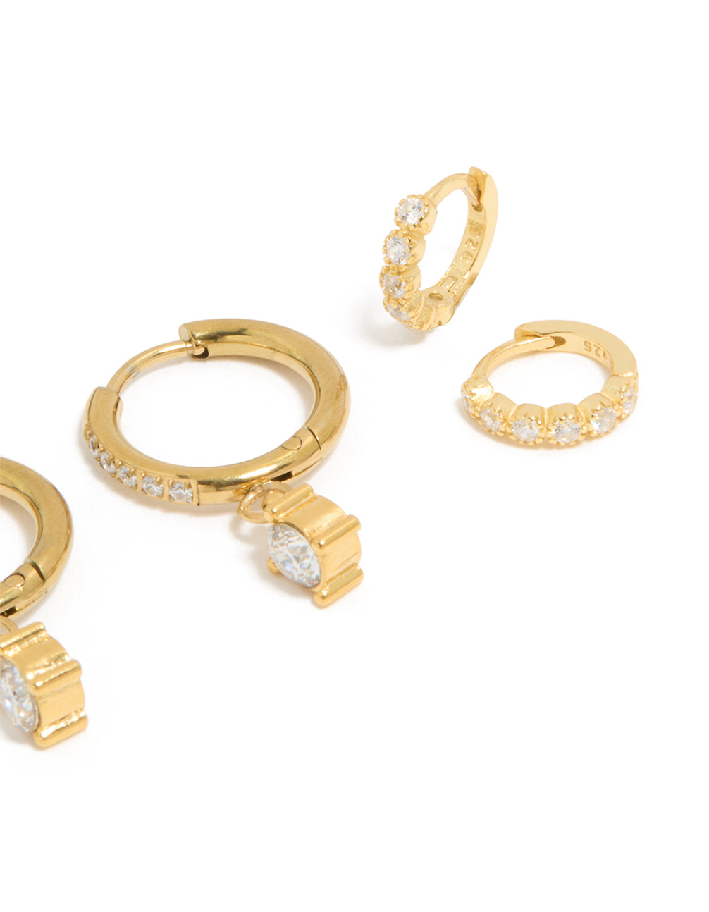 Highlighting these waterproof gold plated stainless steel cubic zirconia stud and huggie earrings in a 3-pack featuring crystal post detail view