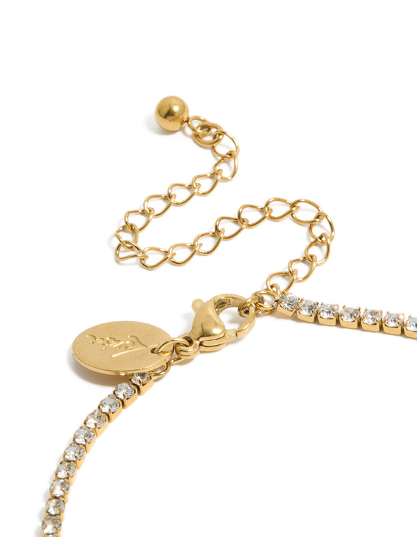 Lobster clasp and adjustable chain closure on a waterproof gold plated stainless steel tennis bracelet with cubic zirconia stones and letter C initial in closure detail view