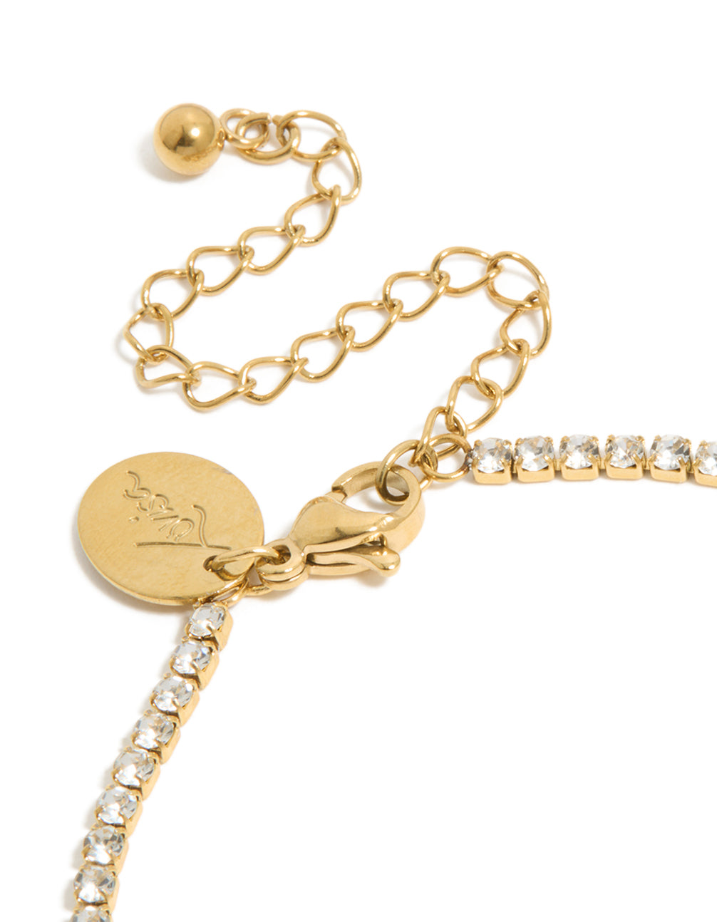 Featuring a waterproof gold plated stainless steel cubic zirconia with letter M initial tennis bracelet in closure detail view