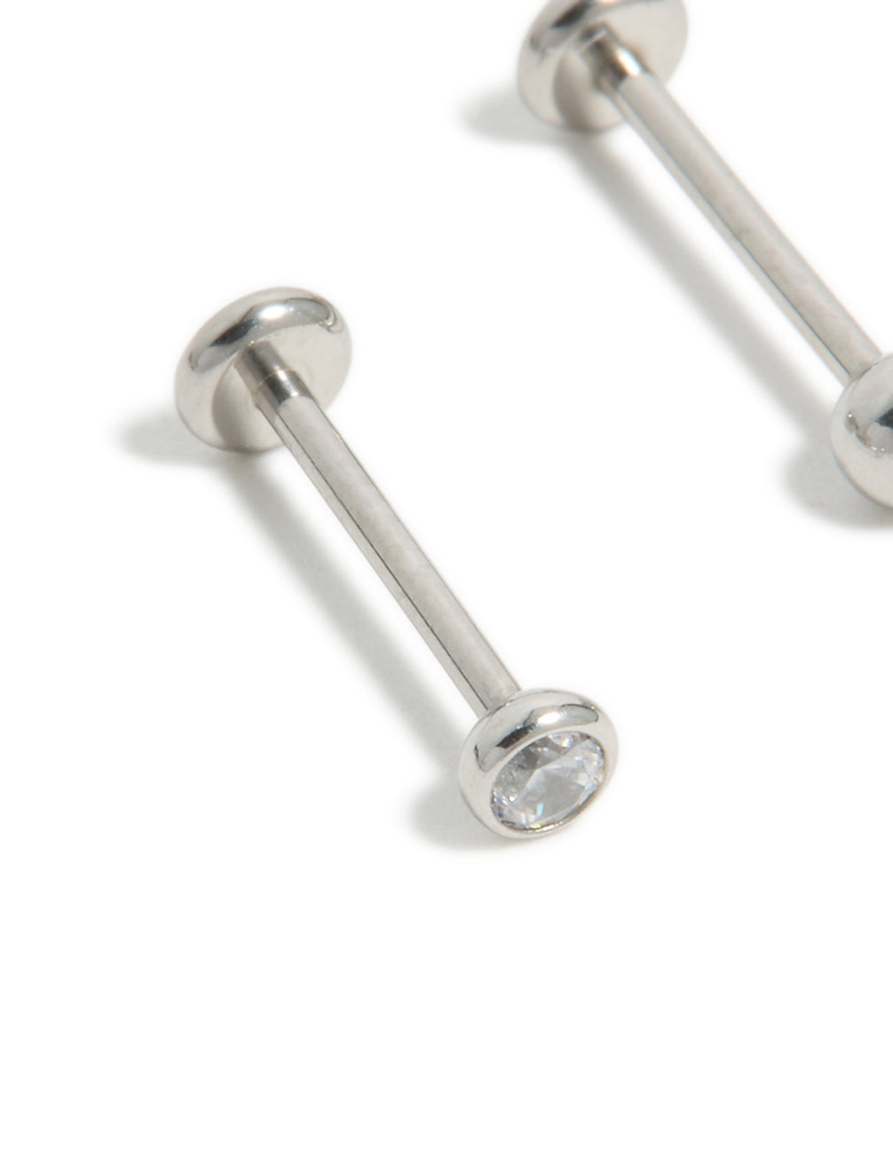 Designed with titanium bezel cubic zirconia threadless flat back nose studs featuring ball accents in silver close up view