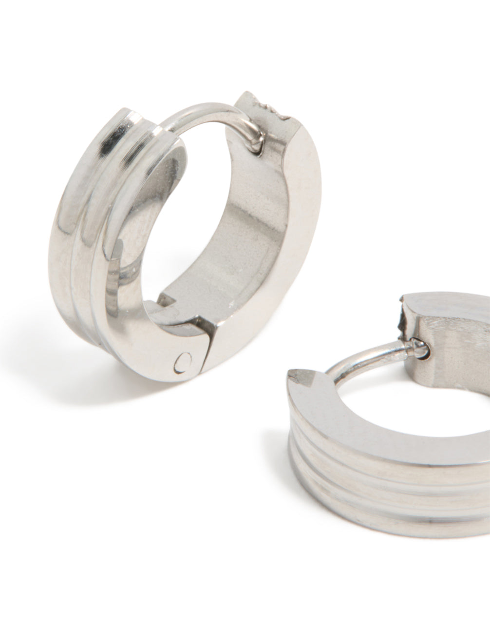 Highlighting mens waterproof stainless steel ribbed huggie earrings in silver close up view