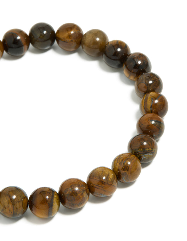 Highlighting mens waterproof stainless steel tiger's eye beaded bracelet in close up view