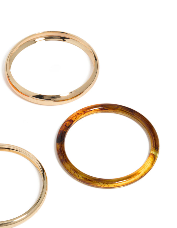 Featuring gold, brown and orange acrylic bangle 4-pack with close up view