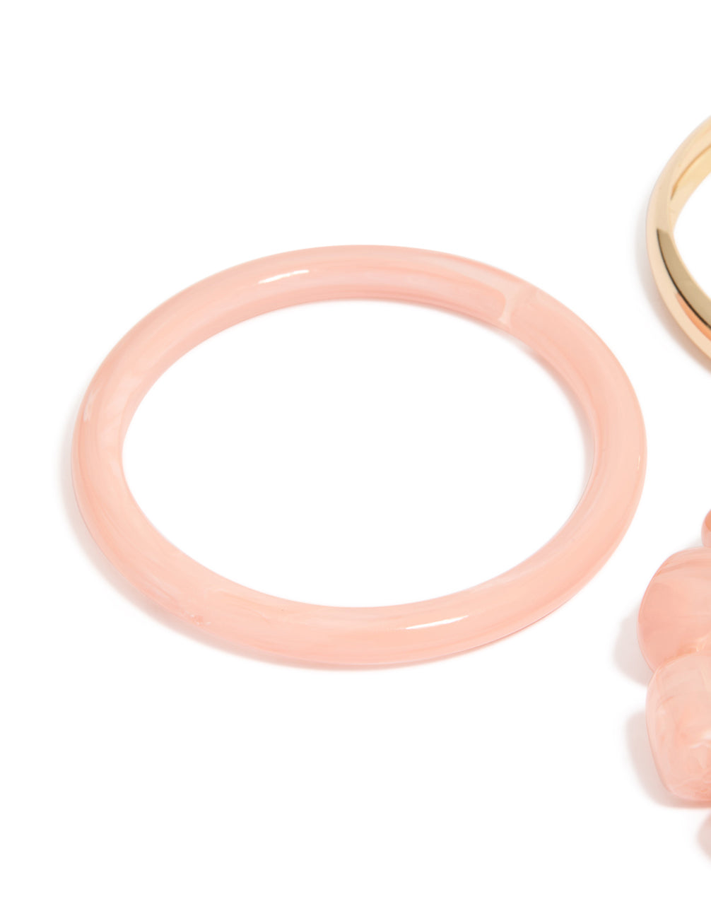Featuring pink acrylic and gold smooth bangles 3-pack with beaded bracelet detail in close up view
