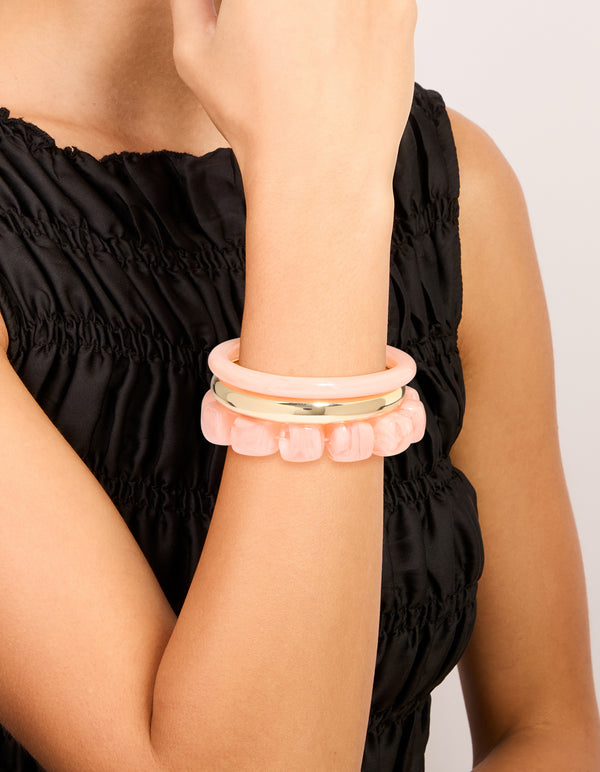 Discover pink acrylic and gold smooth bangless in a stylish 3-pack with beaded bracelet designs on wrist view