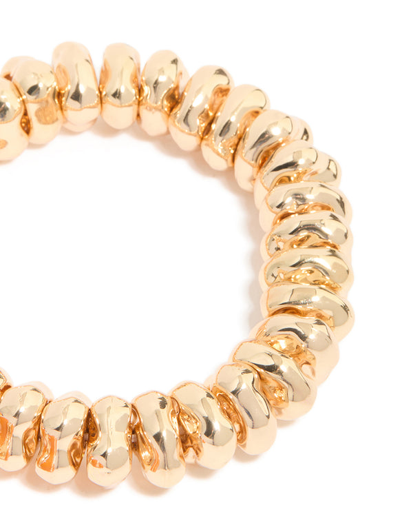 Discover beaded stretch bracelets in a 2-pack crafted from cord material with gold and orange hues in close up view