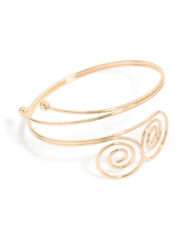 Crafted from gold double swirl arm cuff with statement design in front view