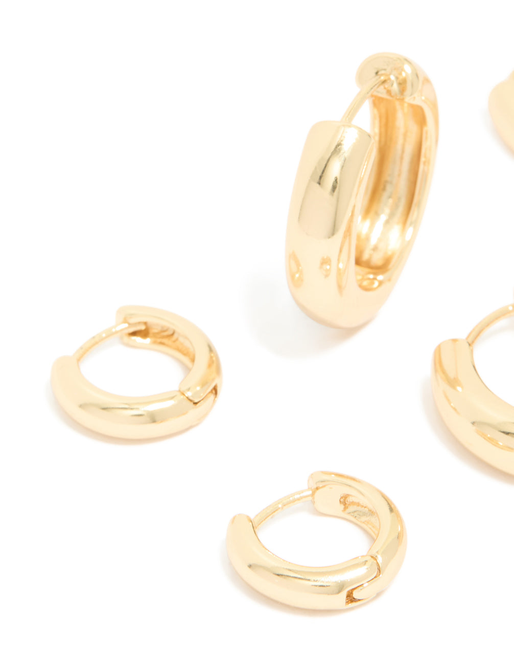 Close up view of gold plated thick hoop earrings 3-pack highlighting polished finish
