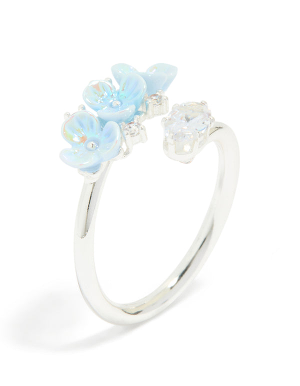 Highlighting a silver plated triple flower wrap ring in powder blue and clear featuring statement design side detail view