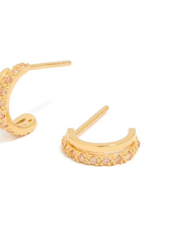 Displaying gold plated sterling silver cubic zirconia double hoop huggie earrings with pink accents post detail view