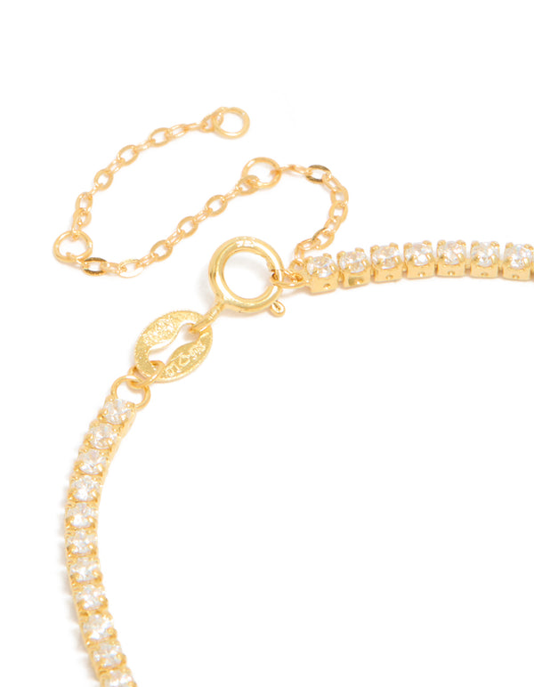 Beautiful gold plated sterling silver tennis bracelet featuring cubic zirconia closure detail view