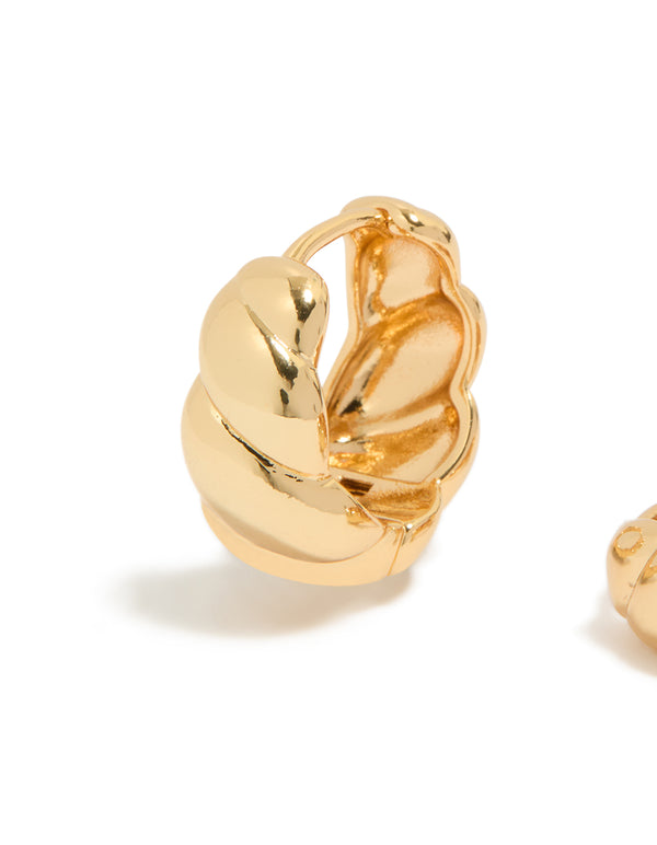 Featuring gold plated brass croissant hoop earrings with braided texture close up view
