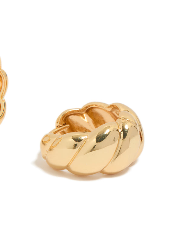 Displaying gold plated brass croissant hoop earrings with visible closure mechanism post detail view
