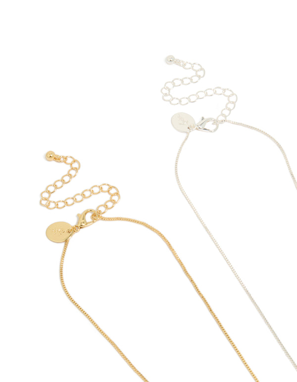 Shop mixed metal plated brass cubic zirconia cross pendant necklaces in gold and silver 2-pack clasp detail view