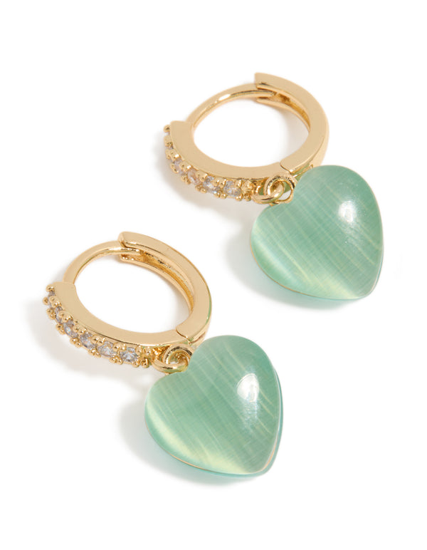 Crafted from gold plated cubic zirconia pave and green heart charm huggie earrings on front view
