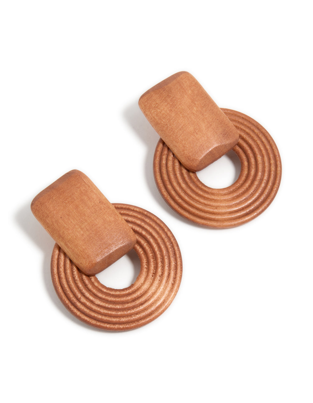 Showcasing wooden textured circle drop earrings in tan and peru tones front view