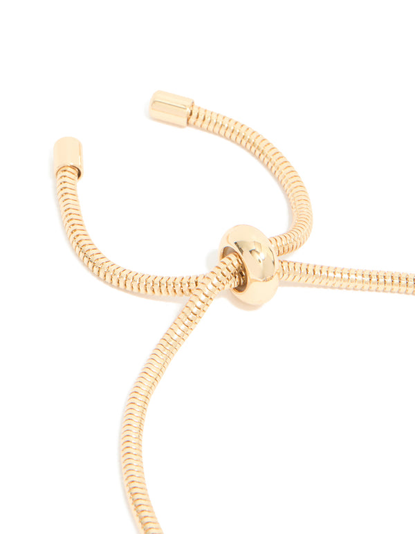 Featuring a gold blue diamante and molten heart charm toggle bracelet with beaded and balls design in closure detail view