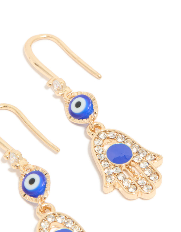 Highlighting gold cubic zirconia evil eye and hamsa hand drop earrings with charm, royal blue, white, and black details from side angle post view
