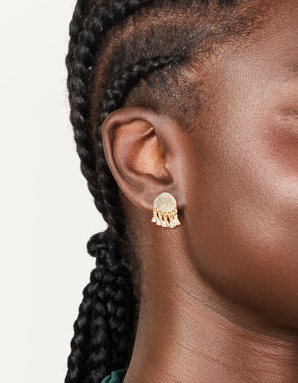 Showcasing gold diamante jellyfish stud earrings featuring charm with ocean-inspired design and white ivory accents on ear view