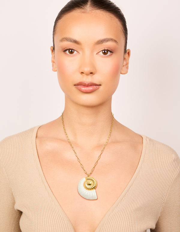 Designed with waterproof gold plated stainless steel oversized shell pendant necklace featuring in ivory accent on model view