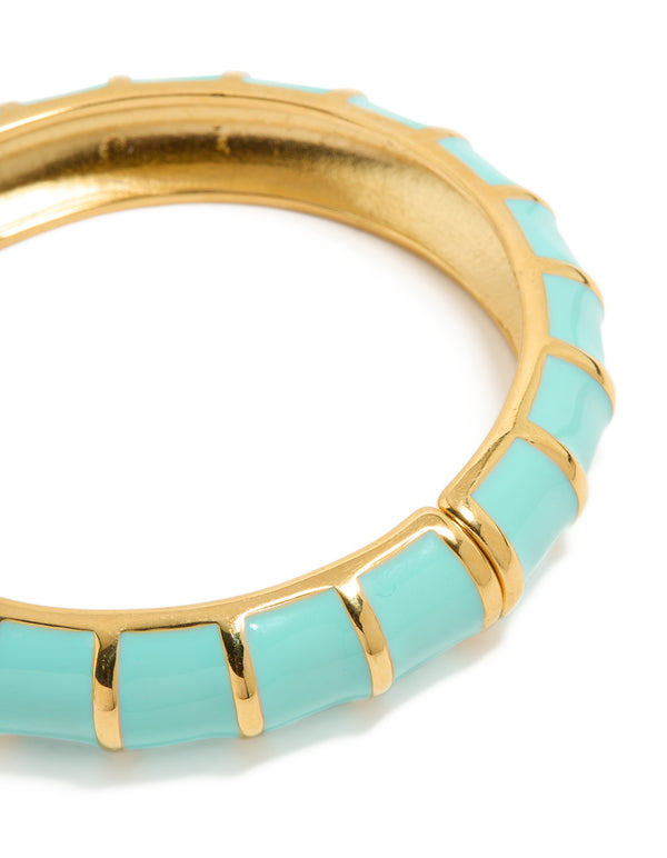 Explore this waterproof ribbed blue enamel bangle crafted from stainless steel with gold plating close up view