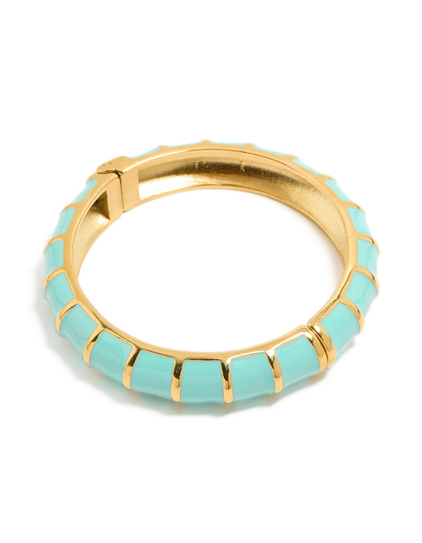 Discover this waterproof ribbed blue enamel bangle crafted from stainless steel with gold plating front view