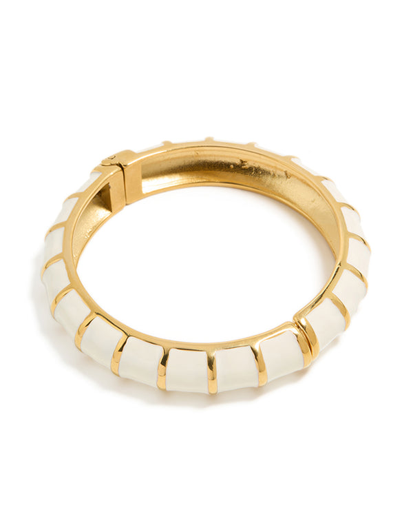 Showcasing a waterproof ribbed bangle crafted from gold plated stainless steel with white enamel front view