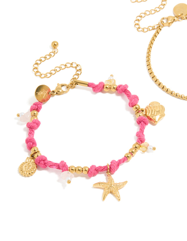 Featuring waterproof gold plated stainless steel cord bracelets in a 2-pack with ocean charms, beads, rose quartz and freshwater pearl details in pink and white close up view
