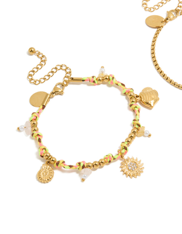 Featuring waterproof gold plated stainless steel freshwater pearl and multicoloured cord charm bracelets with celestial sun, shell, coin, rose quartz, and beads in a 2-pack close up view