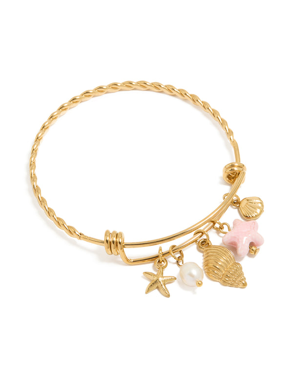 Beautifully designed waterproof stainless steel adjustable bangle featuring ocean-inspired starfish, shell, and freshwater pearl charms in gold plated finish front view