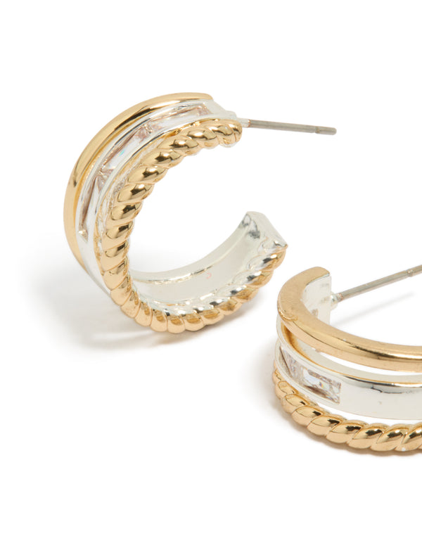 Elegant mixed metal triple layered small hoop earrings featuring gold plated and silver materials close up view