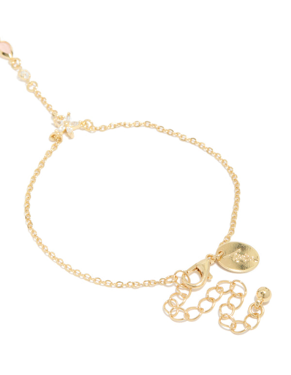 Designed with gold plated pink cubic zirconia teardrop hand chain bracelet in statement style closure detail view