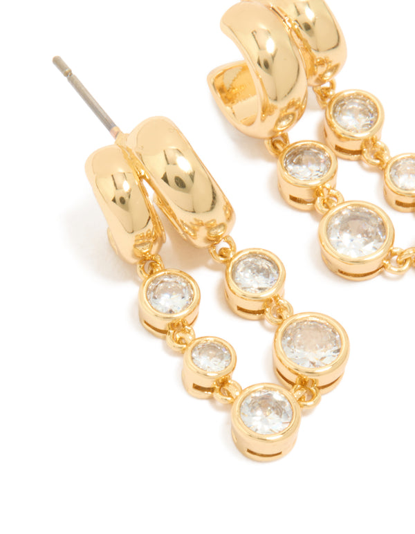 Highlighting gold plated cubic zirconia bezel double hoop drop earrings with intricate detailing in close up view