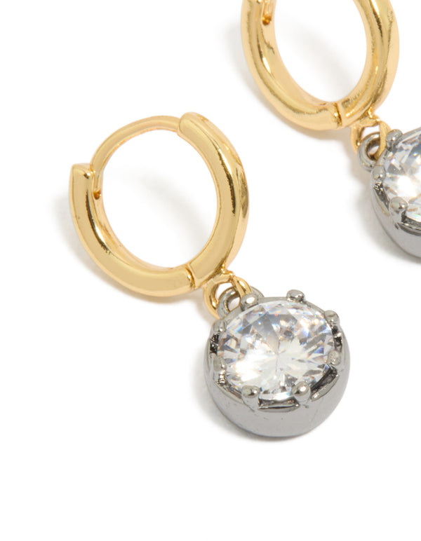 Crafted from mixed metal plated cubic zirconia huggie drop earrings with hoop closure in silver and gold close up view
