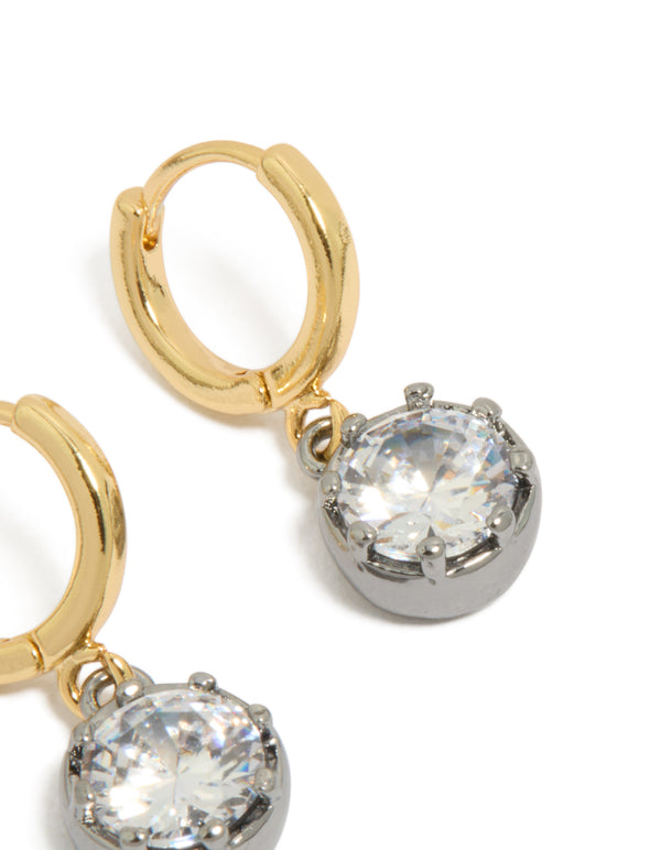 Crafted from mixed metal plated cubic zirconia huggie drop earrings with hoop closure in silver and gold close up view