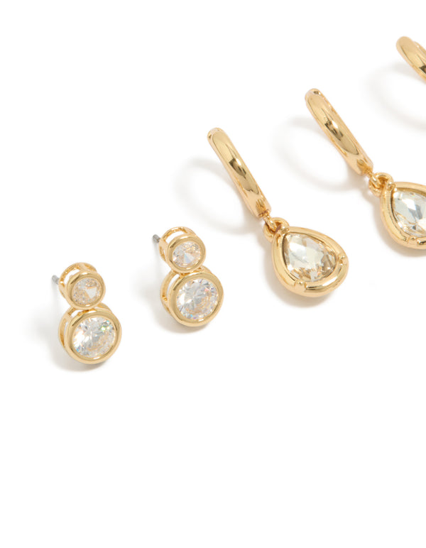 Highlighting large bezel set studs and huggie earrings 3-pack with cubic zirconia in gold plated finish close up view
