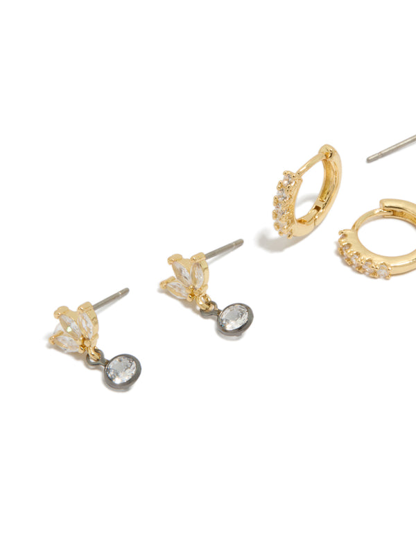 Designed with mixed metal plated cubic zirconia bezel stud and huggie earrings in a 3-pack featuring gold, silver, and clear tones close up view