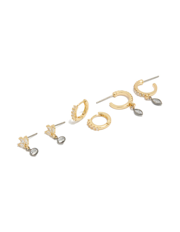 Showcasing mixed metal plated cubic zirconia bezel stud and huggie earrings in a 3-pack featuring gold, silver, and clear tones front view