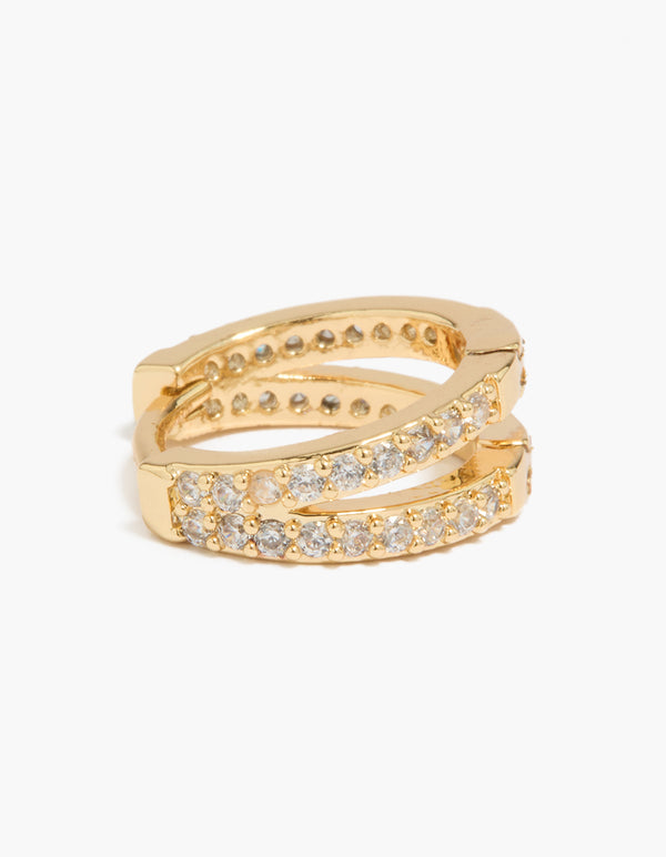 Detailed view of gold plated pavé cubic zirconia layered huggie earrings with closure mechanism close up view
