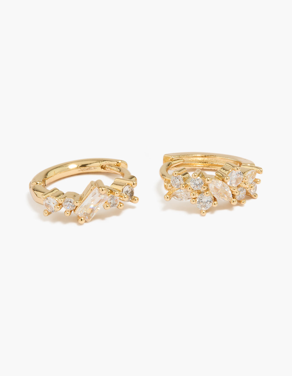 Presenting gold plated cluster cubic zirconia huggie earrings in a 2-pack with huggie closure close up view
