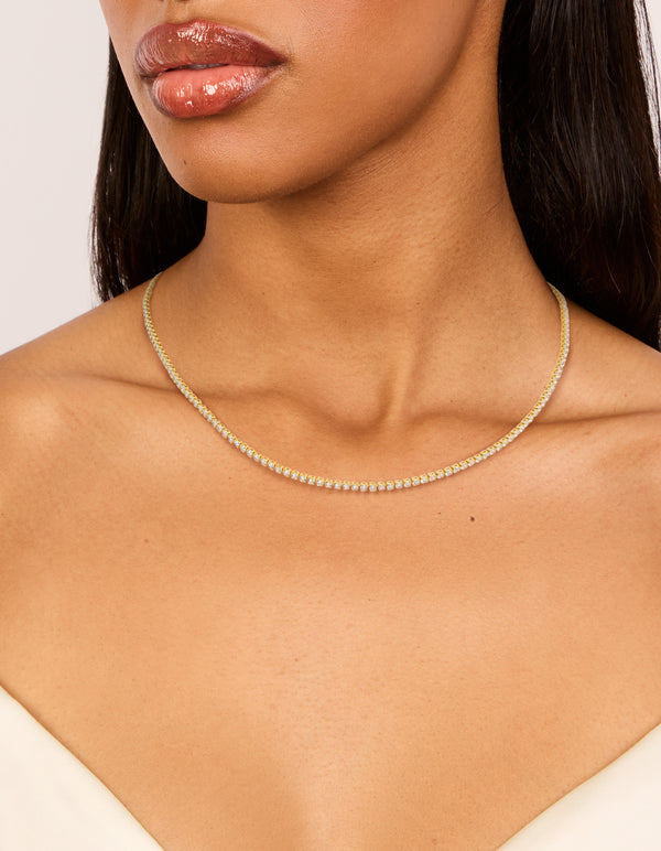 Showcasing a gold plated tiny cubic zirconias tennis necklace on neck view
