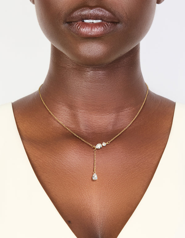 Capturing a gold plated cubic zirconia trio Y-necklace on neck view