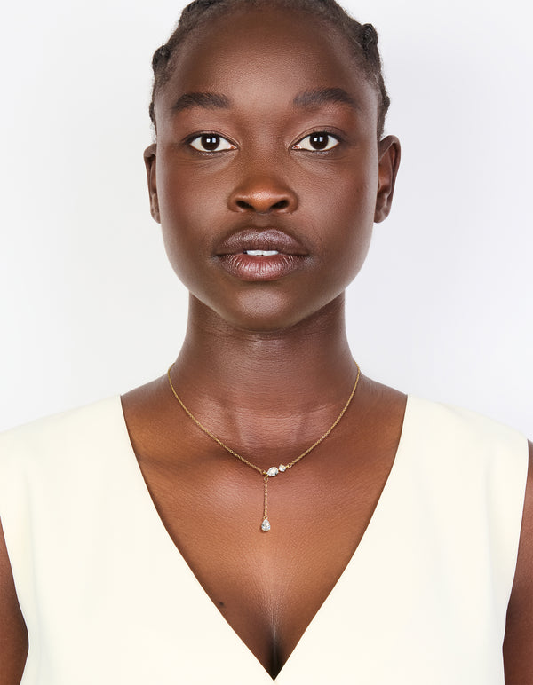 Featuring a gold plated cubic zirconia trio Y-necklace on model view