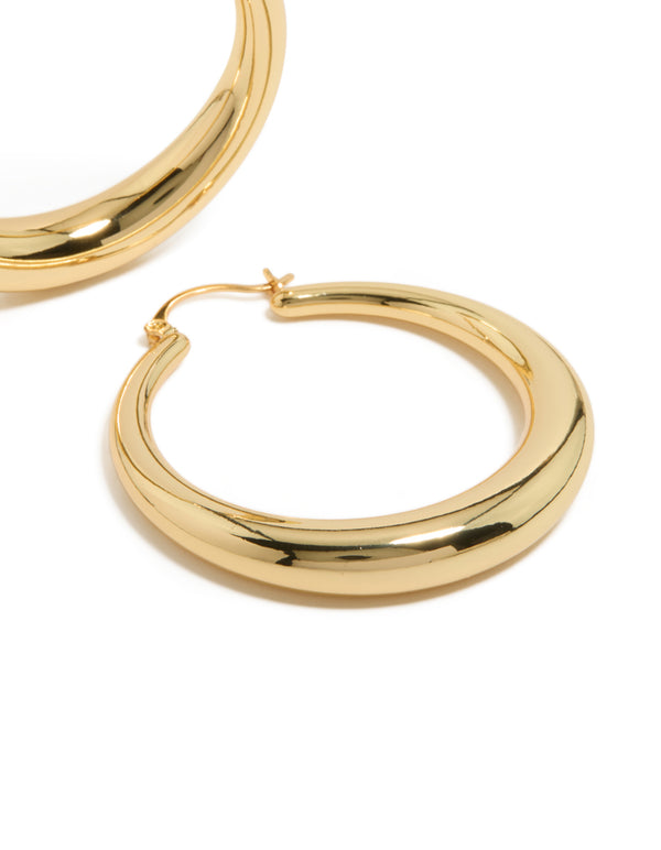 Highlighting gold plated thick thin hoop earrings with closure post detail view