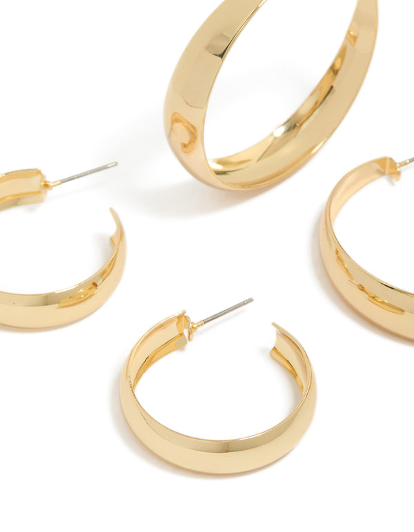 Showcasing gold plated medium and large hoop earrings in a 2-pack close up view