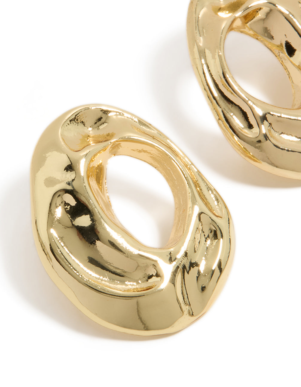 Designed with open organic circle shape in gold plated material close up view