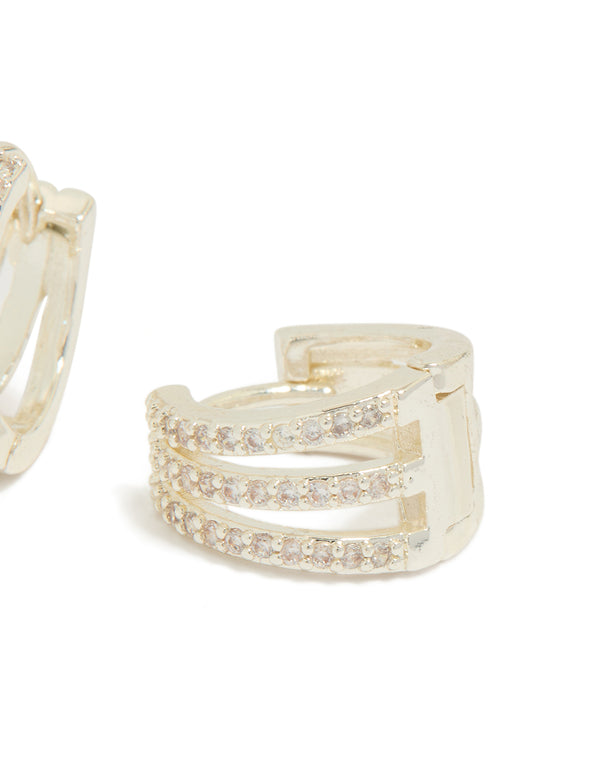 Crafted trio layered huggie earrings featuring cubic zirconia in silver plated finish post detail view