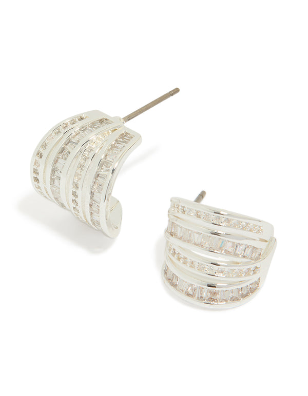 Showcasing silver plated cubic zirconia 4 layered huggie earrings front view