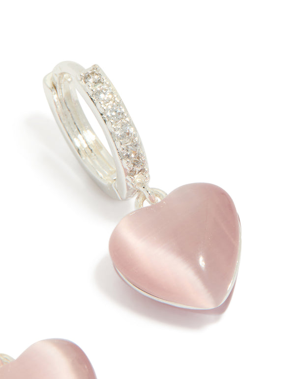 Explore dainty hoop earrings with heart drop, crafted from silver plated cubic zirconia in light pink post detail view