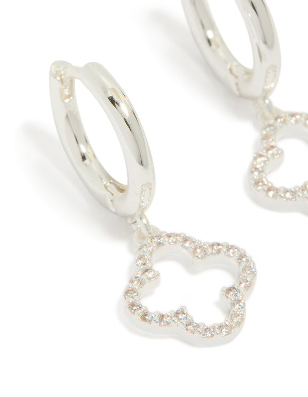 Crafted from silver plated cubic zirconia with flower huggie drop earrings in dainty hoop closure close up view